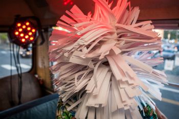 A surreal being (in fantastic paper-sliced full head piece) on the welcome (?) bus at Surreal 13 extravaganza at Live Arts in Charlottesville